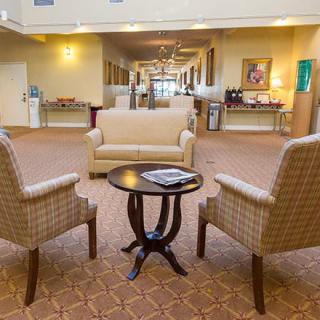 A comfortable hotel lobby with plush seating and a warm ambiance.