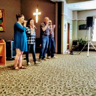 A group of individuals participating in a performance during a community event.