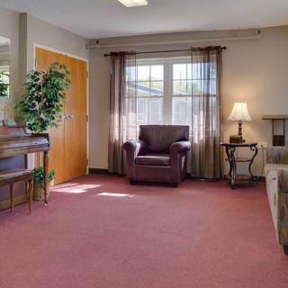 A cozy living room with comfortable seating and natural light.