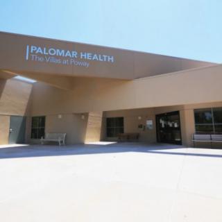 The entrance of a modern healthcare facility.