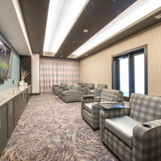 A modern lounge with comfortable seating and elegant decor.