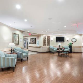 A spacious and well-lit lobby area with comfortable seating and elegant decor.