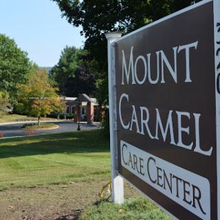 Entrance sign of Mount Carmel Care Center, indicating a healthcare facility.
