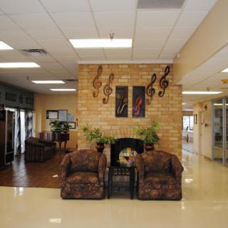 A cozy lobby area featuring comfortable seating and music-themed decorations.