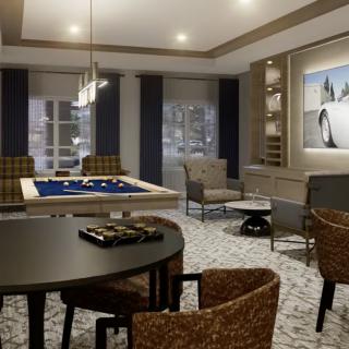 A cozy living room featuring stylish furniture and elegant lighting.