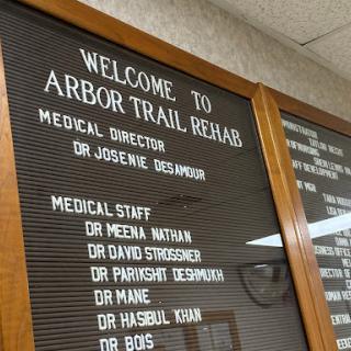 Welcome sign displaying the staff directory at Arbor Trail Rehab.