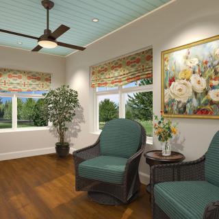 A cozy living room with comfortable chairs, a plant, and a colorful painting on the wall.