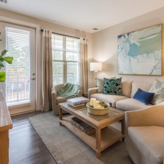 A cozy living room with a modern sofa, coffee table, and stylish decor.