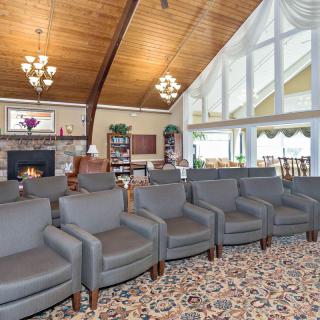 Spacious lounge area with comfortable seating and a cozy fireplace.