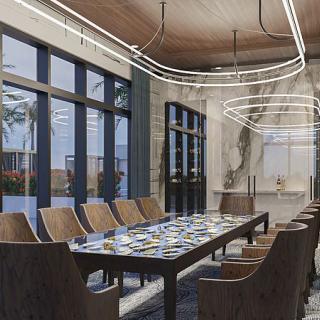 A modern dining room with a large table and elegant lighting.