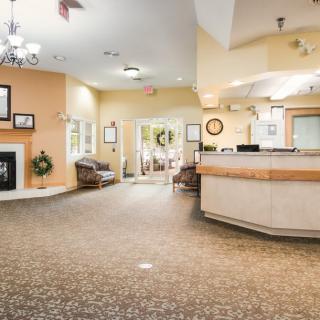 A welcoming lobby with a reception desk and waiting area.