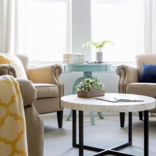 A cozy and modern living room with comfortable seating and stylish decor.