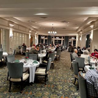 A cozy restaurant atmosphere filled with diners enjoying their meals.