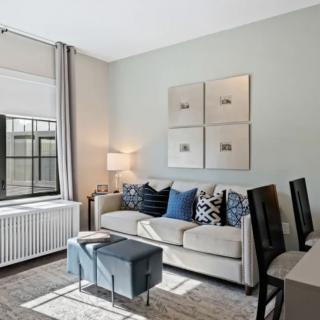 A modern living room with stylish decor and cozy seating.