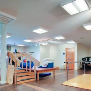 A rehabilitation center equipped with various exercise and therapy equipment.