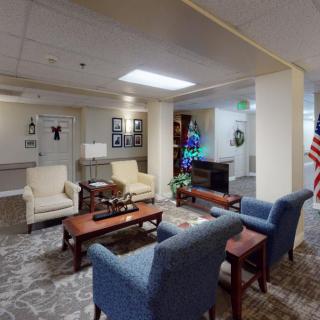 A cozy lobby area with seating arrangements and festive decorations.
