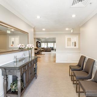 A serene waiting area featuring comfortable seating and elegant decor.