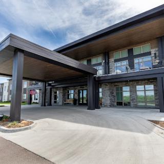 A contemporary commercial building featuring a sleek entrance and modern architectural design.
