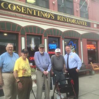 A group of people standing in front of Casentino's Restaurant.
