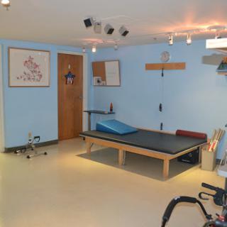 A well-equipped physical therapy room designed for rehabilitation and healing.