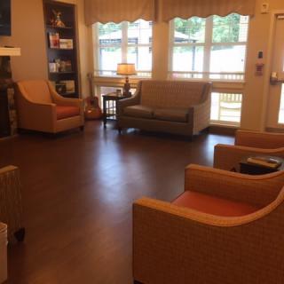 Cozy living room with comfortable seating and natural light.