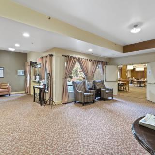 A spacious lobby area featuring comfortable seating and elegant decor.