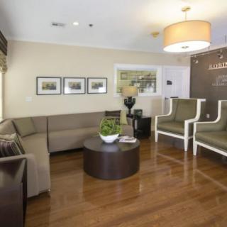 A modern living room with comfortable seating and elegant decor.