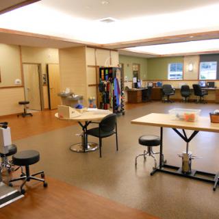 A spacious and well-equipped therapy room designed for rehabilitation purposes.