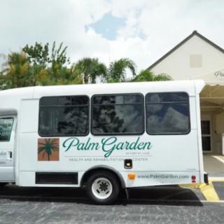 A white shuttle bus with 'Palm Garden' branding parked outside a healthcare facility.