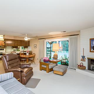 Cozy living room with an open layout that includes the kitchen and dining area.