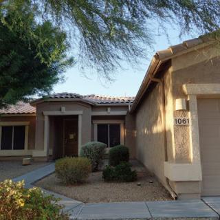 A welcoming residential home with a landscaped front yard.