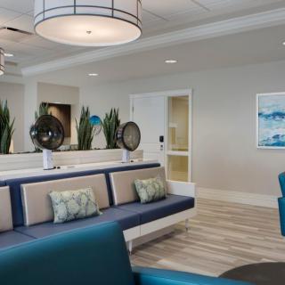 A modern lobby with stylish seating and decorative lighting.