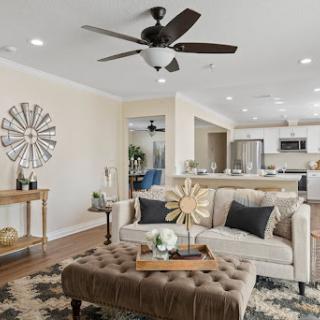 A beautifully designed living room featuring a cozy sofa, stylish coffee table, and an inviting atmosphere.
