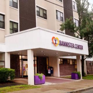 Entrance of a healthcare facility with a welcoming sign.