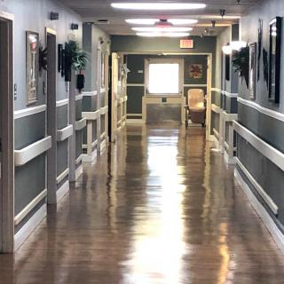 A well-lit and clean hallway in a building.