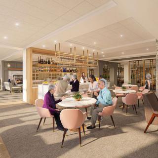 A modern dining area with people enjoying their meals and socializing.