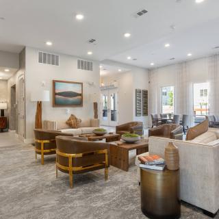 A modern and spacious living room featuring elegant interior design with comfortable seating and stylish decor.