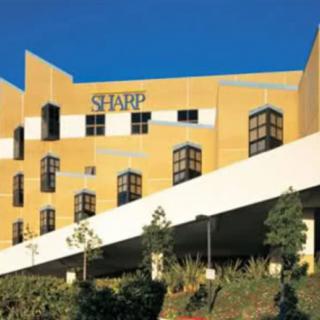 Exterior view of a Sharp hospital building with unique architecture.