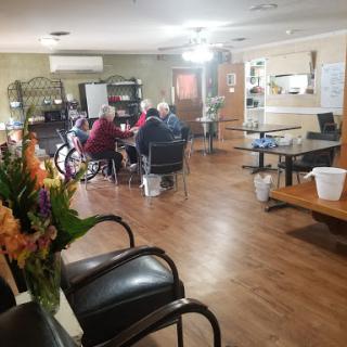 A cozy community space where seniors gather for activities and companionship.