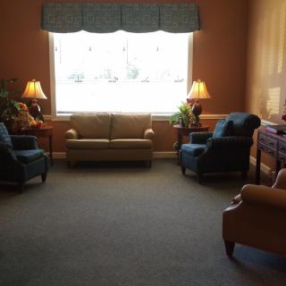 A cozy living room with comfortable seating and natural light.