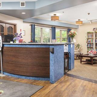 A welcoming reception area with a modern desk and comfortable seating.