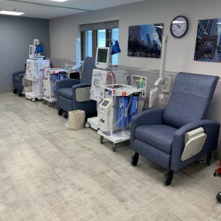 A room equipped with dialysis stations and comfortable treatment chairs.
