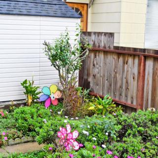 A vibrant garden with colorful decorations and lush greenery.