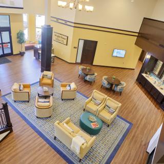 A spacious lobby with comfortable seating and modern decor.