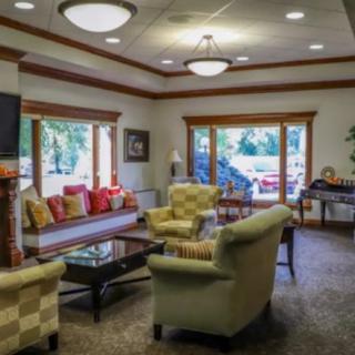 A cozy living room with comfortable seating and natural light.