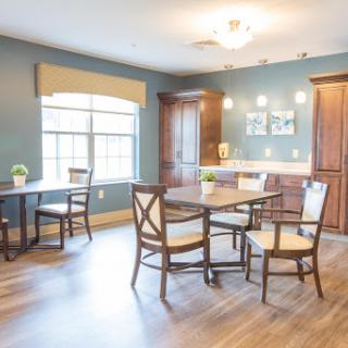 A cozy dining area featuring modern furniture and ample natural light.