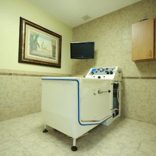A therapy machine set up in a treatment room, ready for patient use.