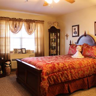 A warm and cozy traditional-style bedroom with elegant decor.