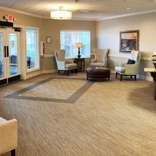 A cozy living room with comfortable seating and warm lighting.