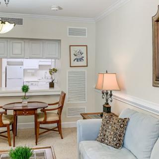 Cozy living room with a small dining area and elegant decor.